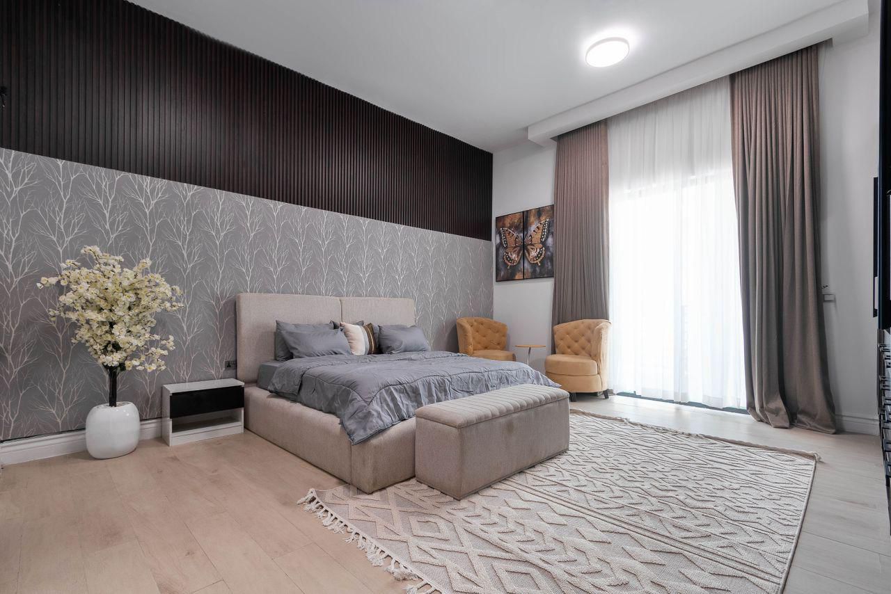 Bedroom with Dark Fluted Panel and Botanical Wallpaper