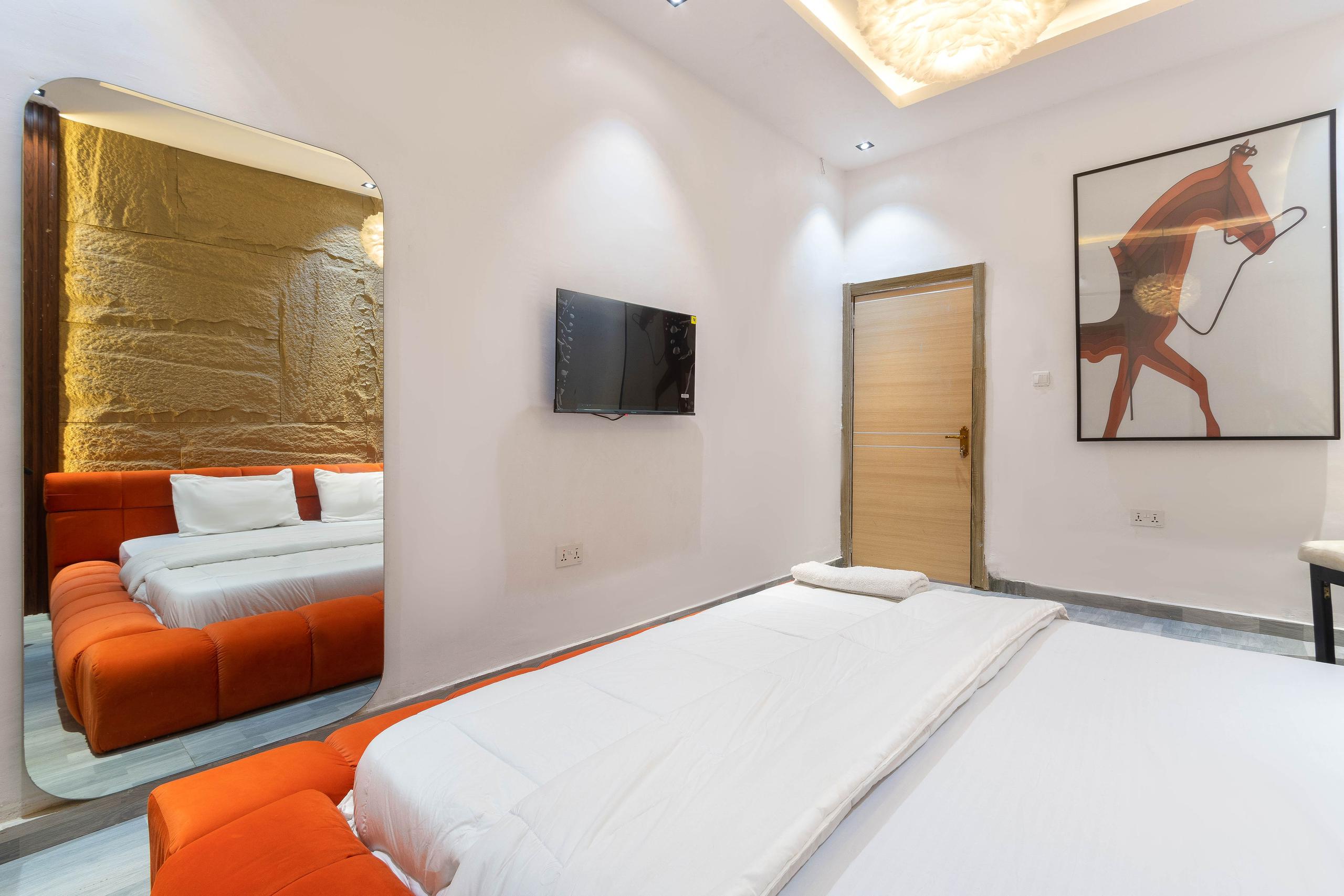 Bedroom with Floor-to-Ceiling Arched Mirror