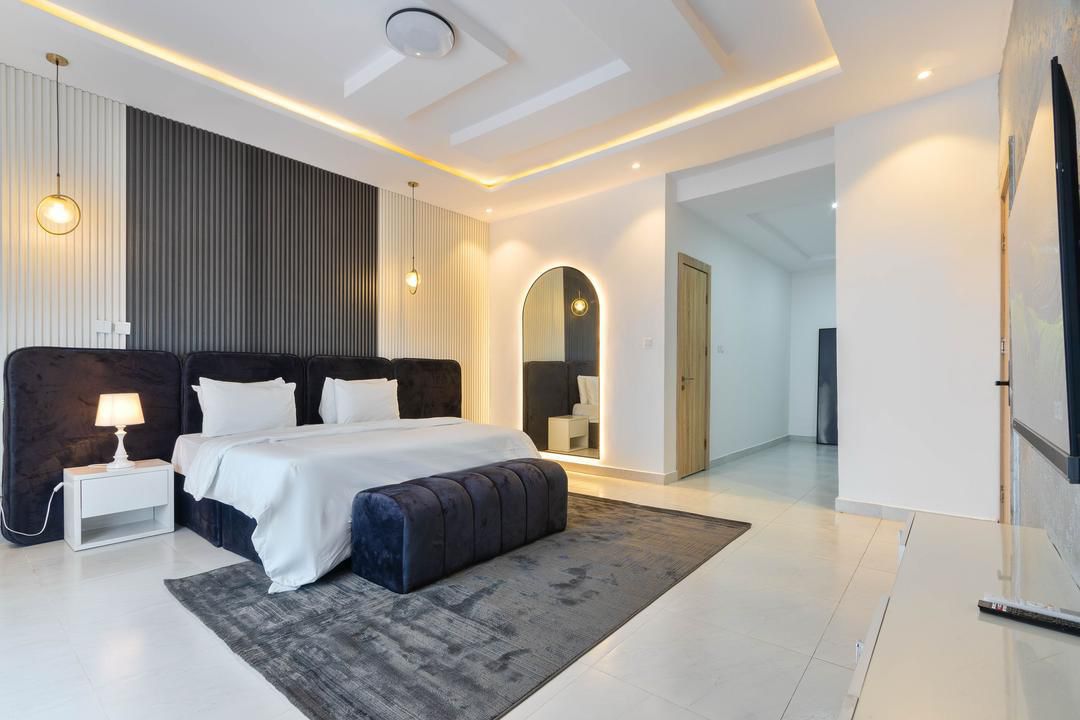 Master Bedroom with Backlit Arched Mirror