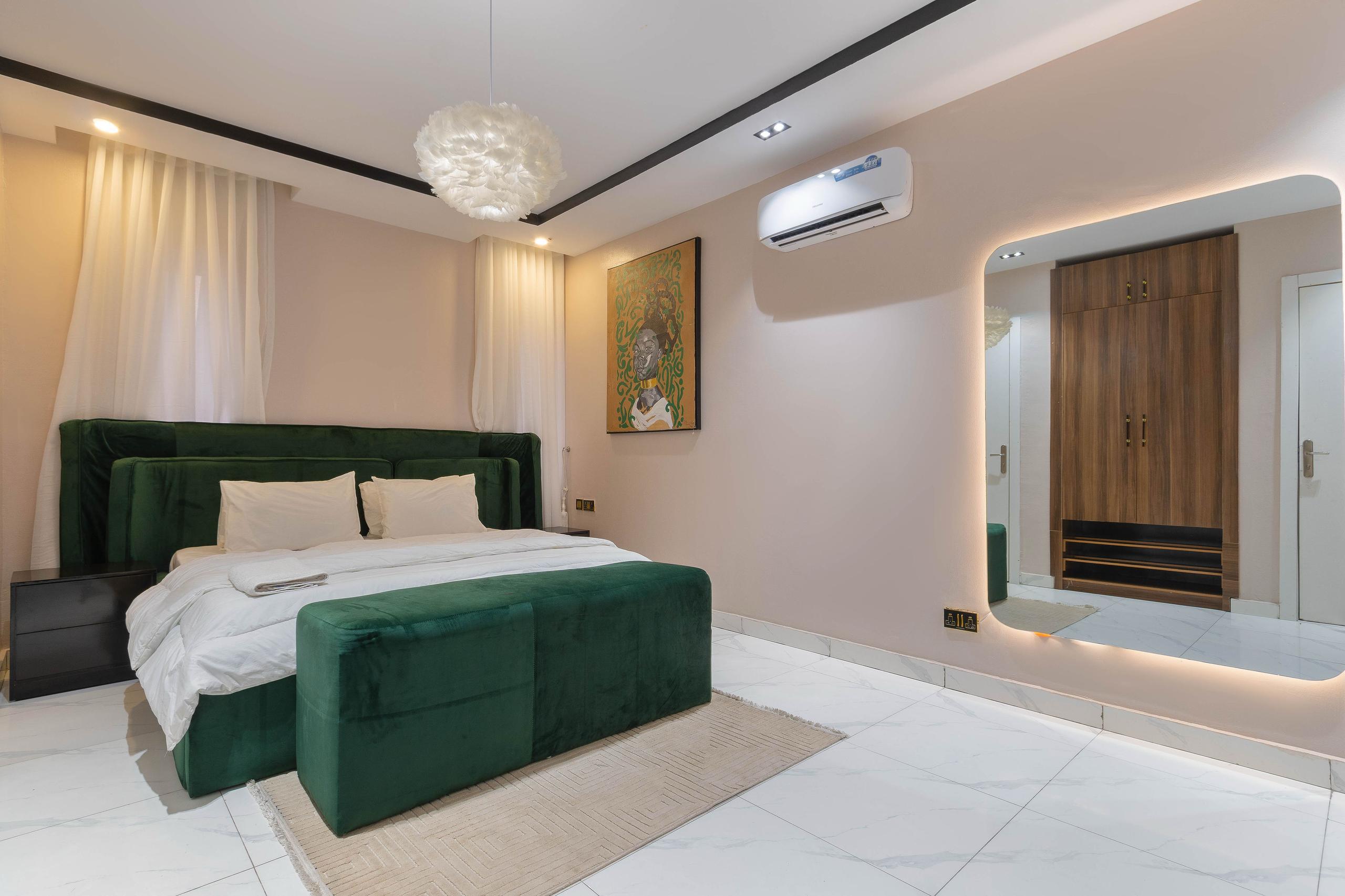 Emerald Green Bedroom with Backlit Mirror