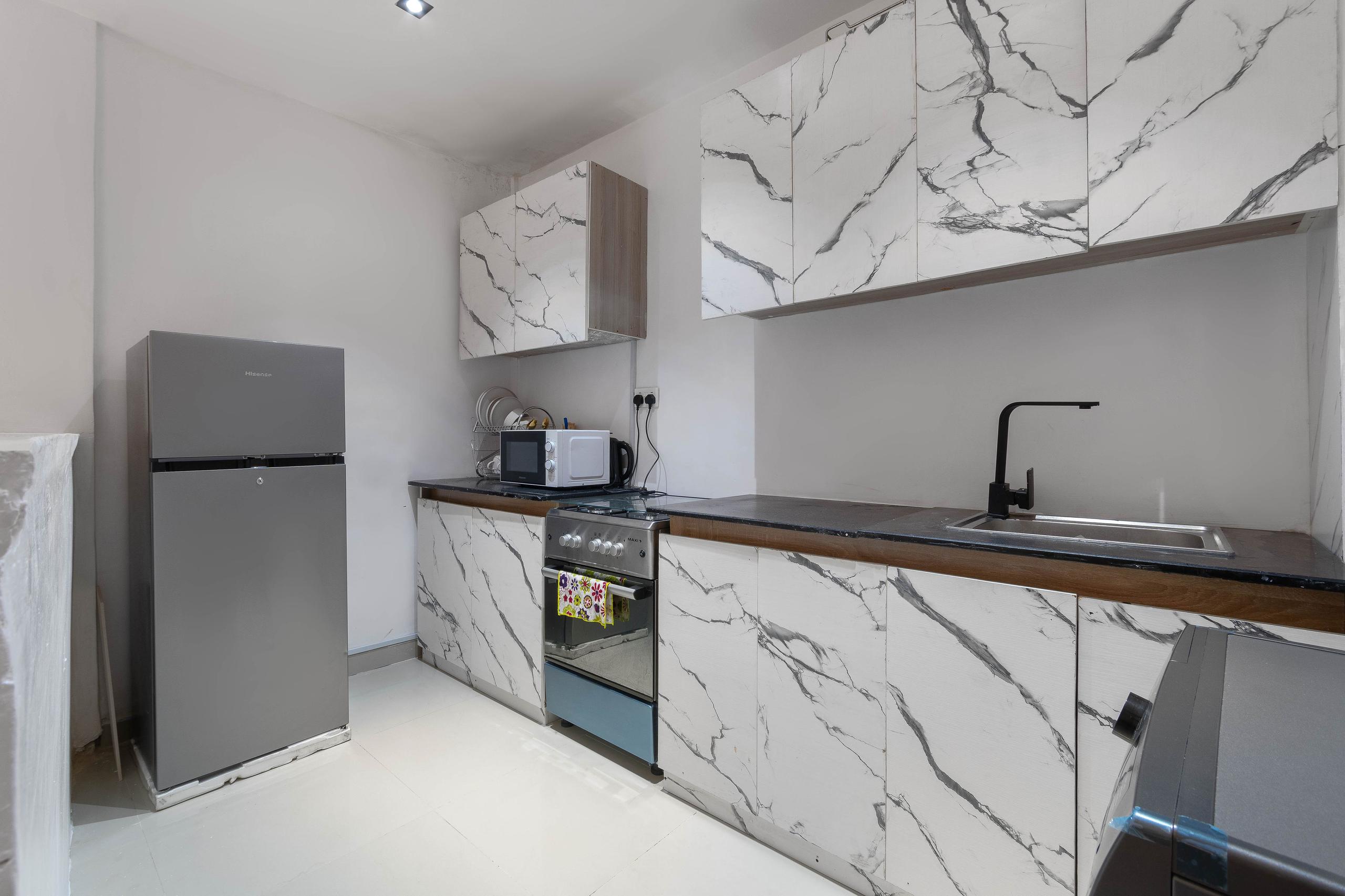 Kitchen with Marble-Veined Cabinetry